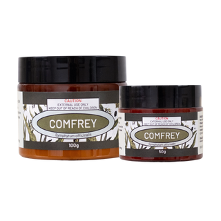 Two jars of comfrey cream with labels on a white background