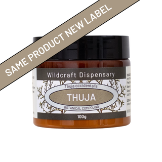 Jar labeled 'Thuja' from Wildcraft Dispensary with a brown label overlay.